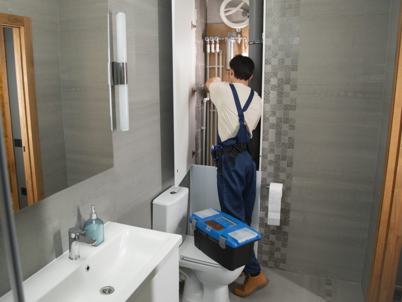 male-plumber-working-fix-problems-client-s-house